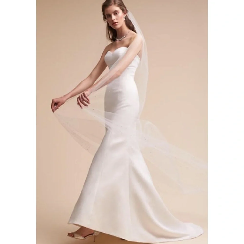 BHLDN Strapless White Mermaid Wedding Gown with Covered Buttons